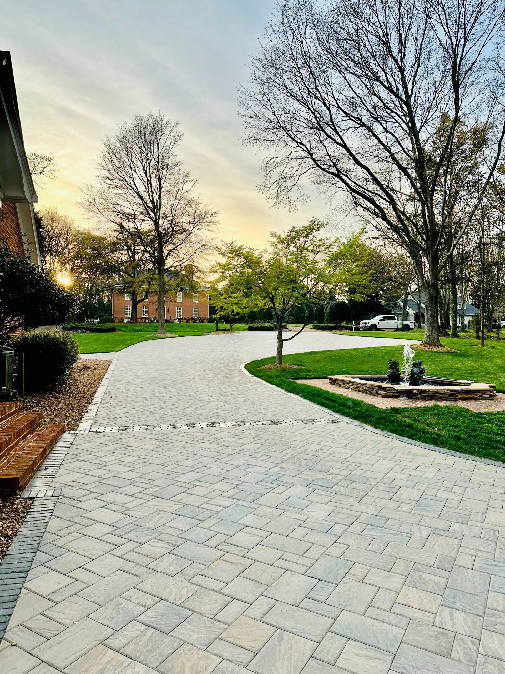 Wide view of the paver driveway and fountain courtyard