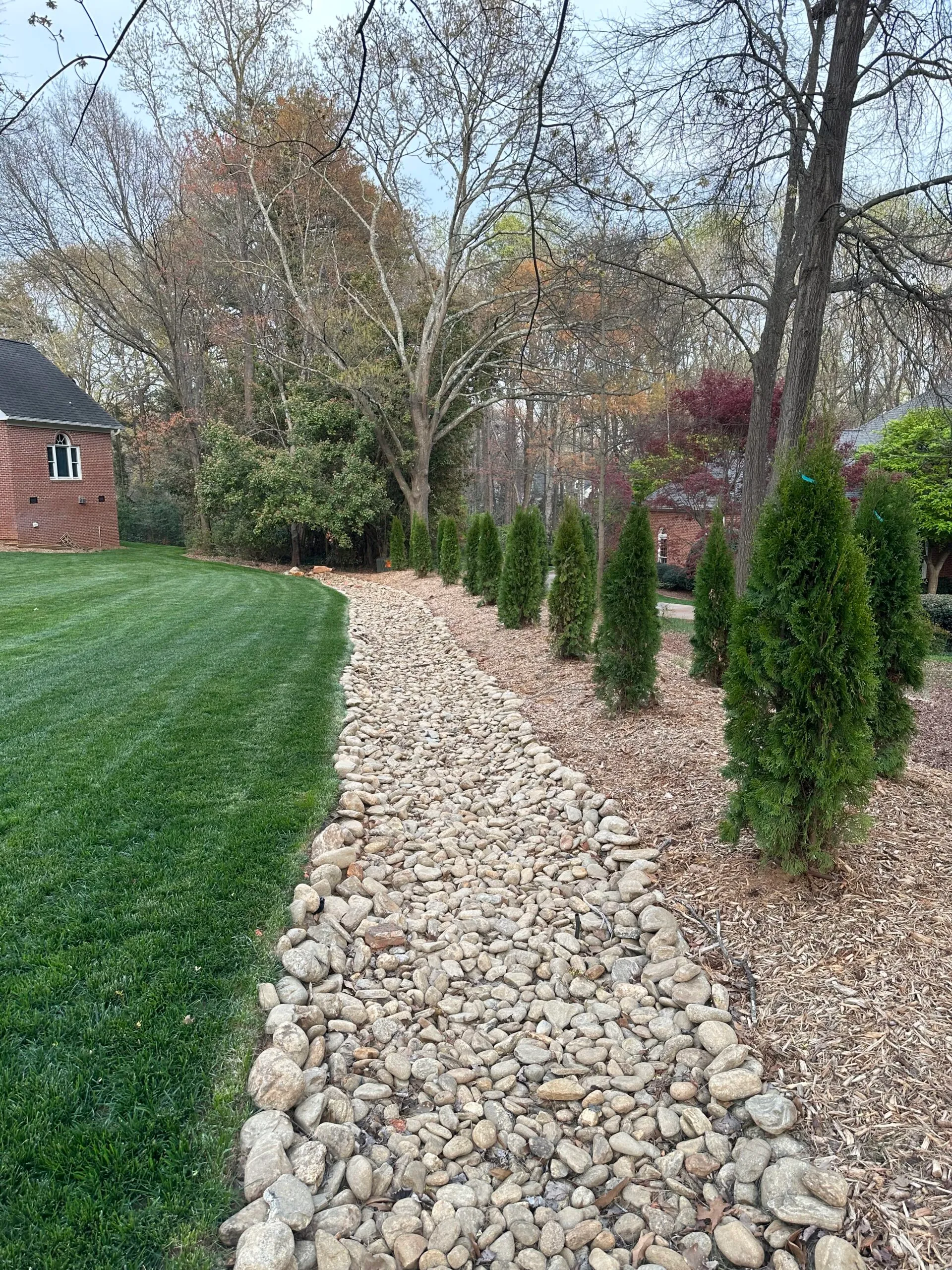 Paver driveway detail near the fountain island planting bed